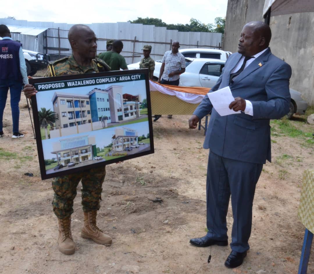 RCC Arua Charles Ichogor in blue, receiving design of the Complex